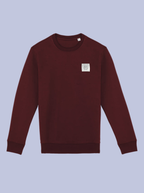 INTRECCI / FELPA GIROCOLLO CON PATCH PICCOLA